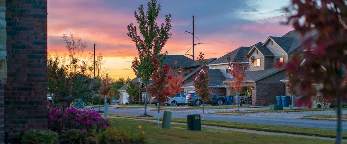 Living in Residential Housing Neighborhood Street at Sunset in Bentonville Arkansas